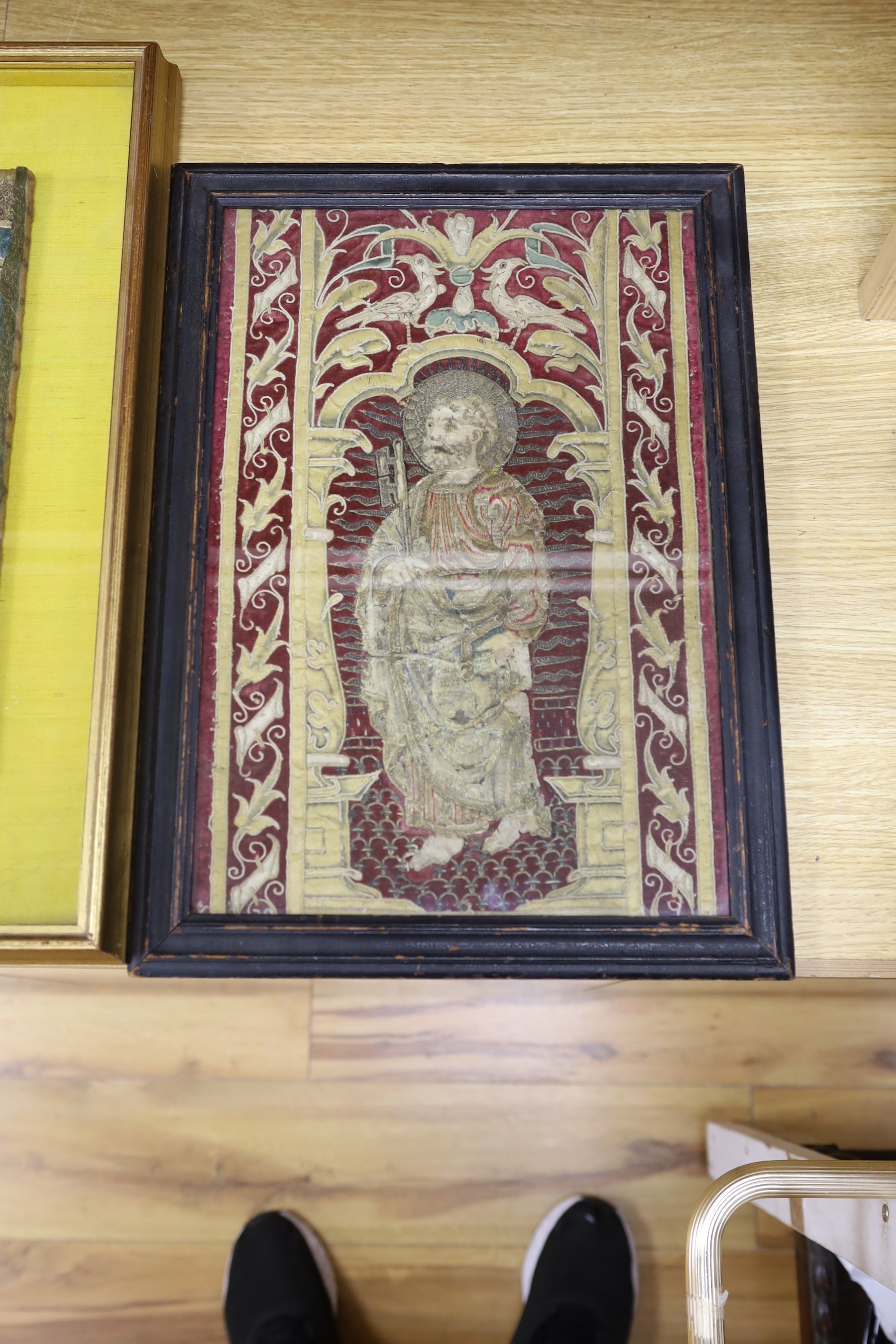 Two 18th century framed silk work religious panels and another later on canvas, largest 39 x 27cm